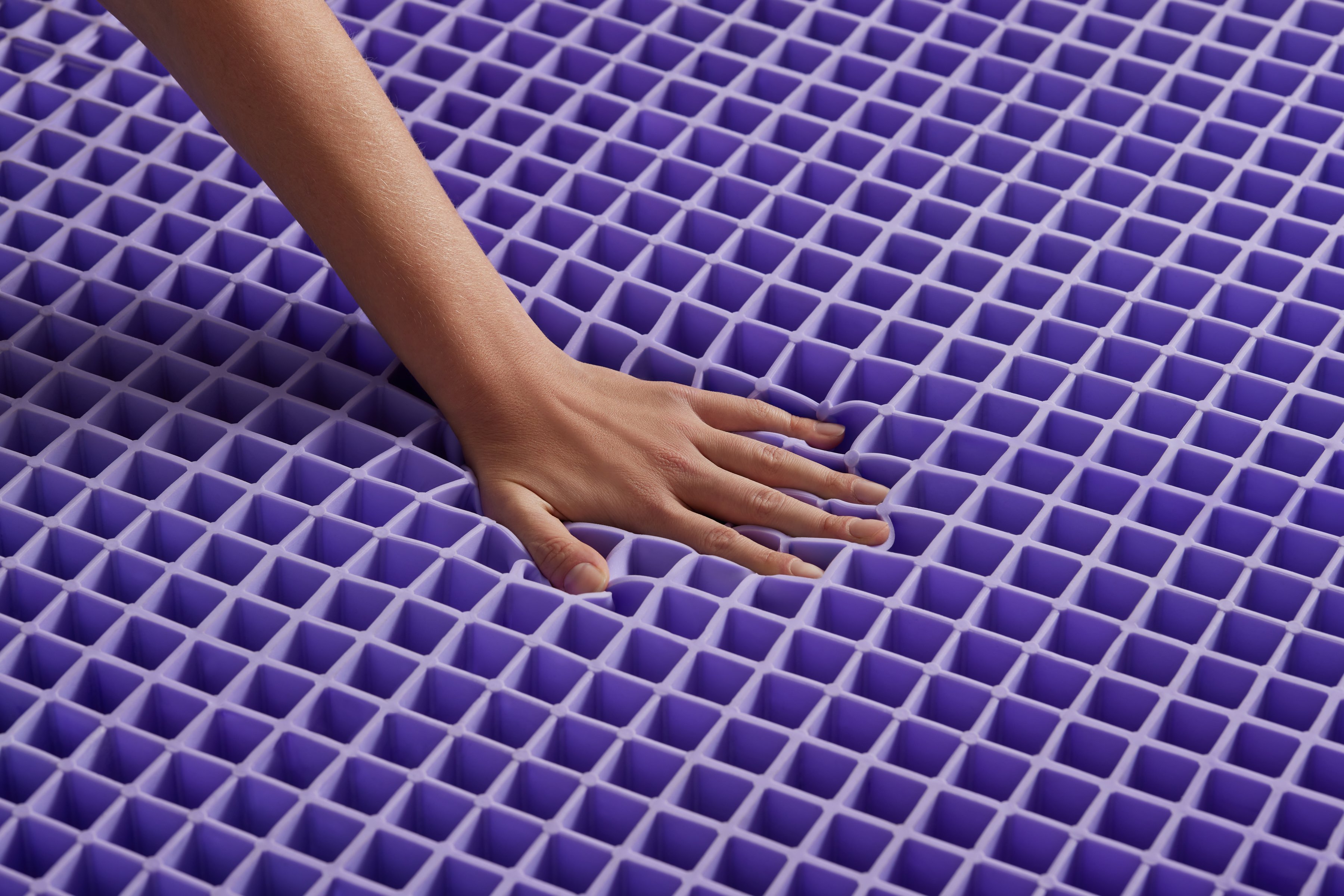 Hand on Purple Grid