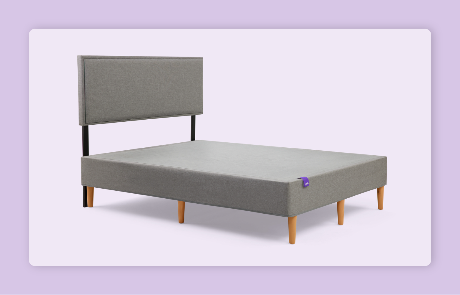 The Purple Foundation in stone grey shown with the matching headboard before a light purple background.