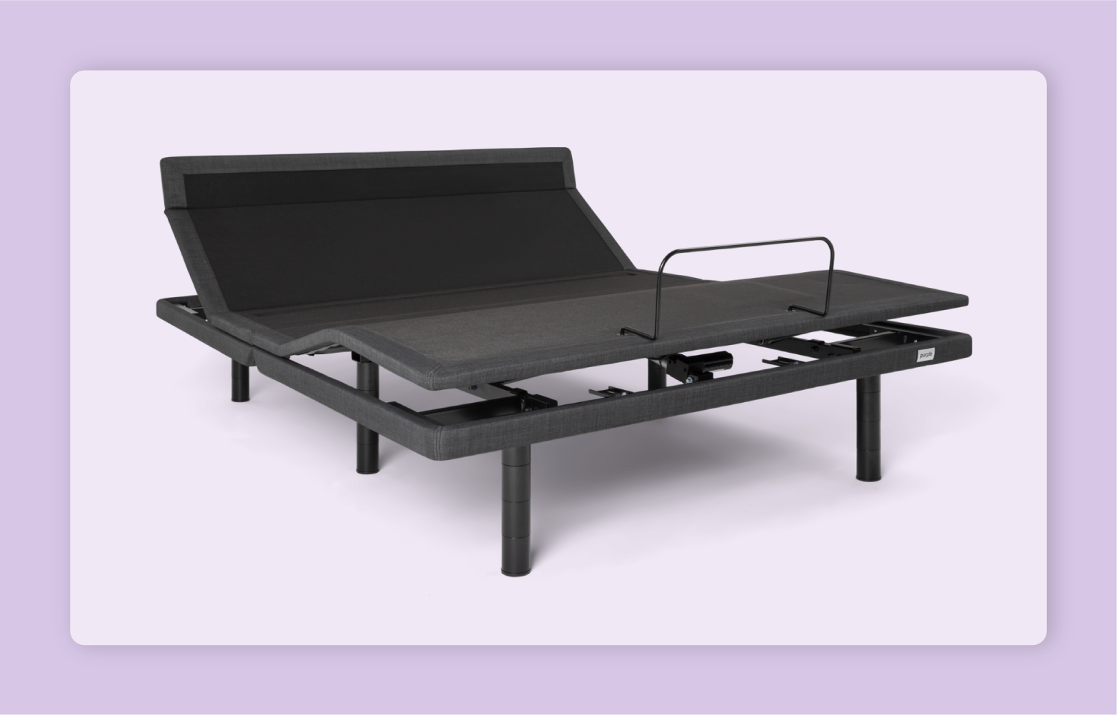 The charcoal gray Purple Premium Plus Smart Base in an inclined position before a light purple background.