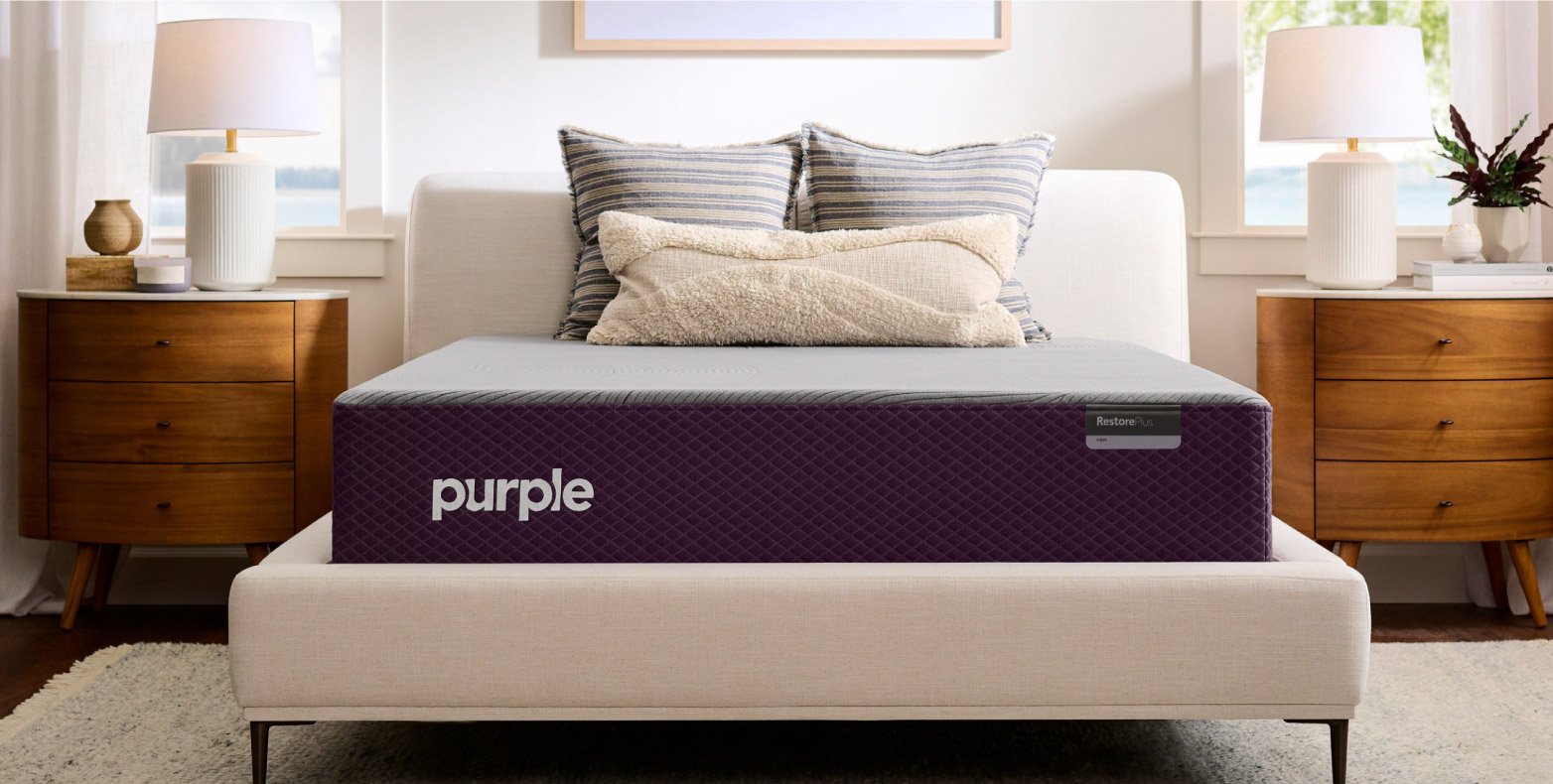 Purple RestorePlus™ Hybrid Mattress in a bedroom.