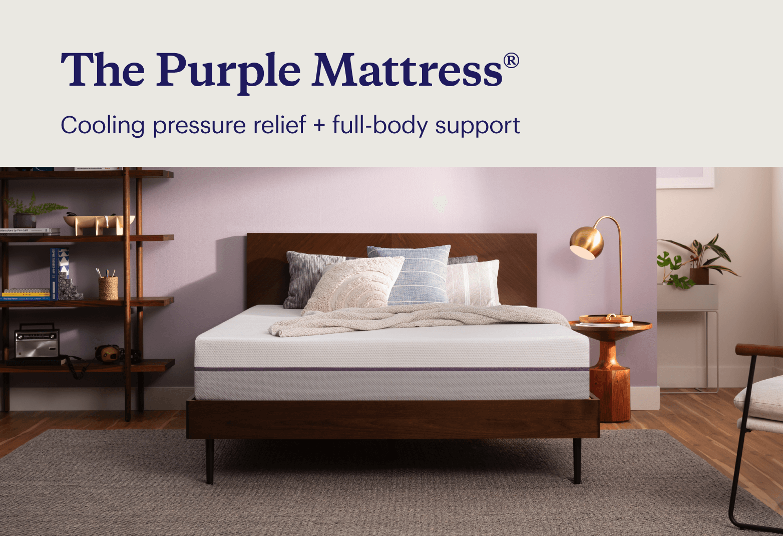 Key features of the Purple Mattress® shown with the mattress in a minimalist purple bedroom.