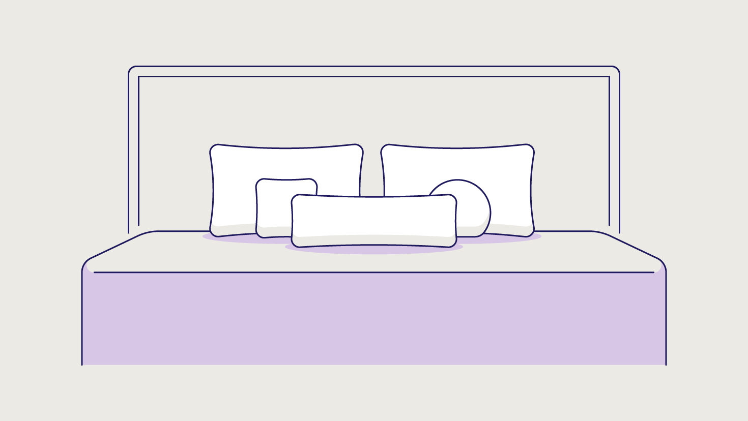 An asymmetrical arrangement of decorative pillows propped against two standard pillows.