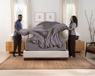 SS sheets gray w/ talent making bed