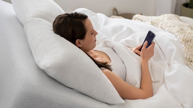 Woman using Purple Smart Base app