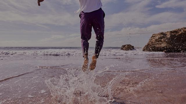 Man Jumping By Ocean