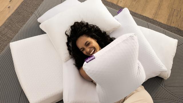 Woman laying on pillows