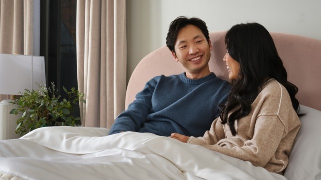 Happy couple laying in bed