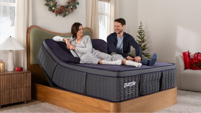 Man and woman sitting on RejuvenatePremier Mattress