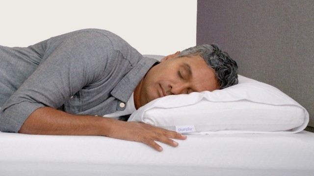 male talent laying on cloud pillow