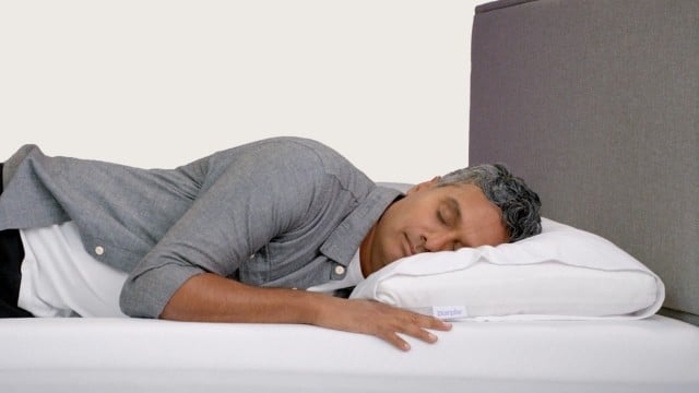 male talent laying on cloud pillow