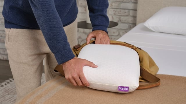 Harmony Anywhere pillow being pulled out of a bag