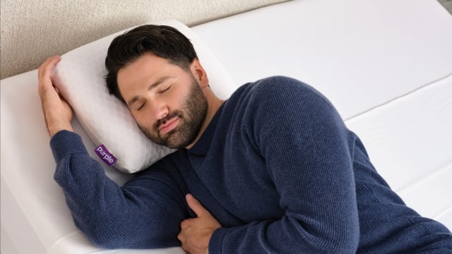 Man lying on Harmony Anywhere pillow