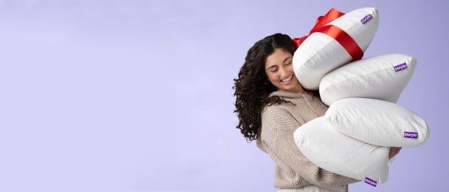 woman holding harmony pillows