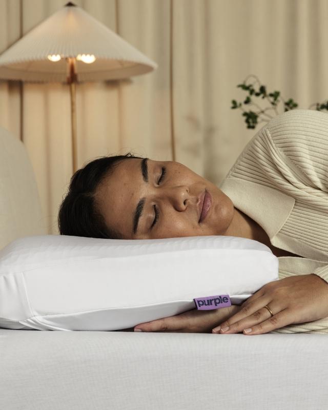 Woman with head on DreamLayer Pillow