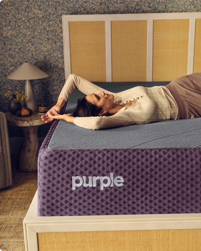 Woman lying on a Restore mattress