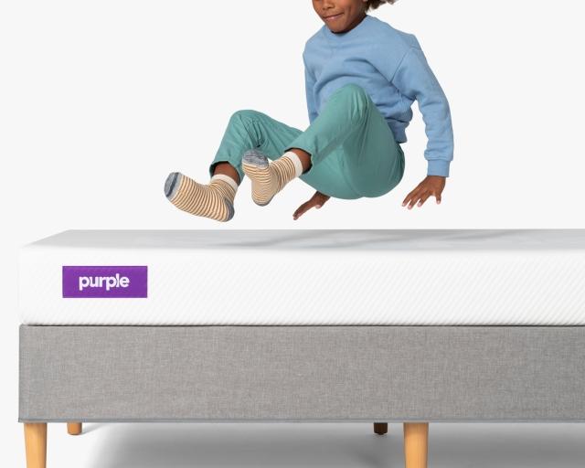 kid jumping on kid mattress