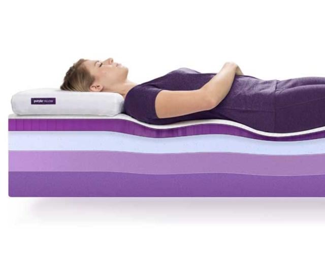 Woman laying on Purple Plus showing mattress layers