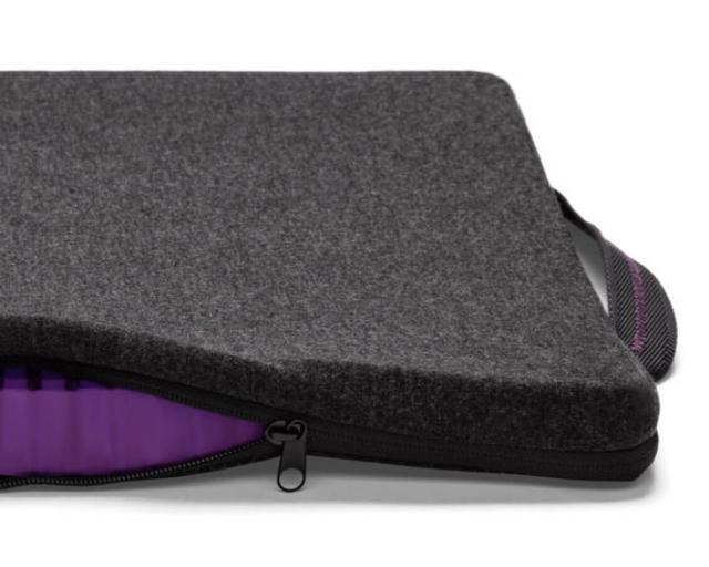 Portable seat cushion with cover partially unzipped