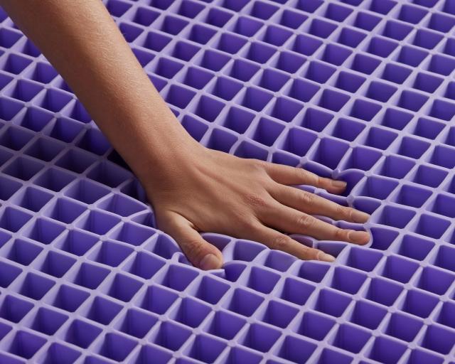 Hand on Purple Grid