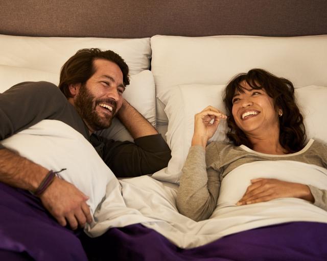 Man & Woman happy in bed