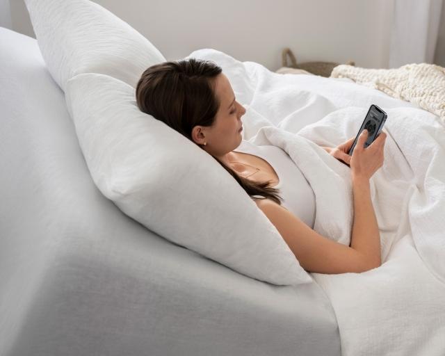 Woman using sleep genius app