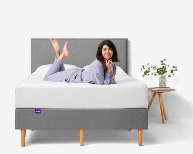 Woman on Purple Bed Frame