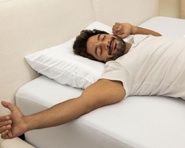 Man using Purple Pillow