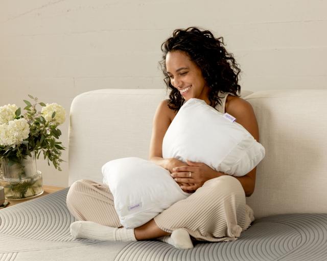 Woman hugging a TwinCloud pillow