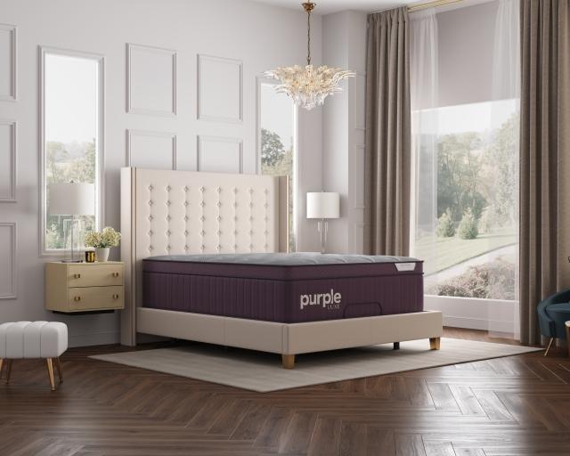 A Purple RejuvenatePlus mattress in an open, airy bedroom.