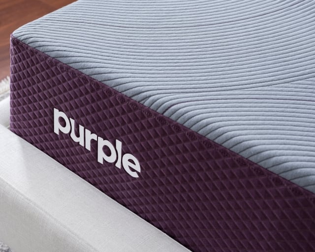 The corner of a Purple Restore Hybrid mattress.