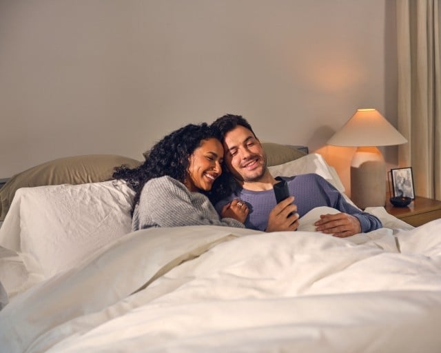 Happy couple laying in bed