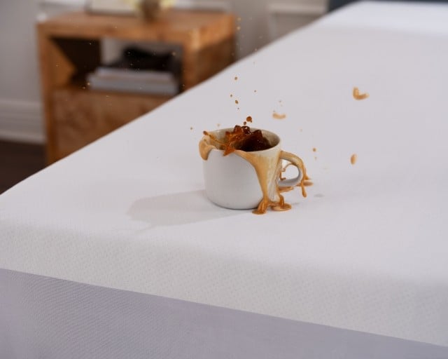 Coffee spilling on mattress protected by mattress protector