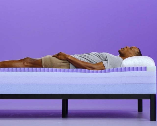 talent laying on grid essential mattress