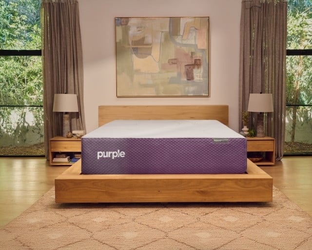 A RestorePlus hybrid mattress in a well-lit bedroom.
