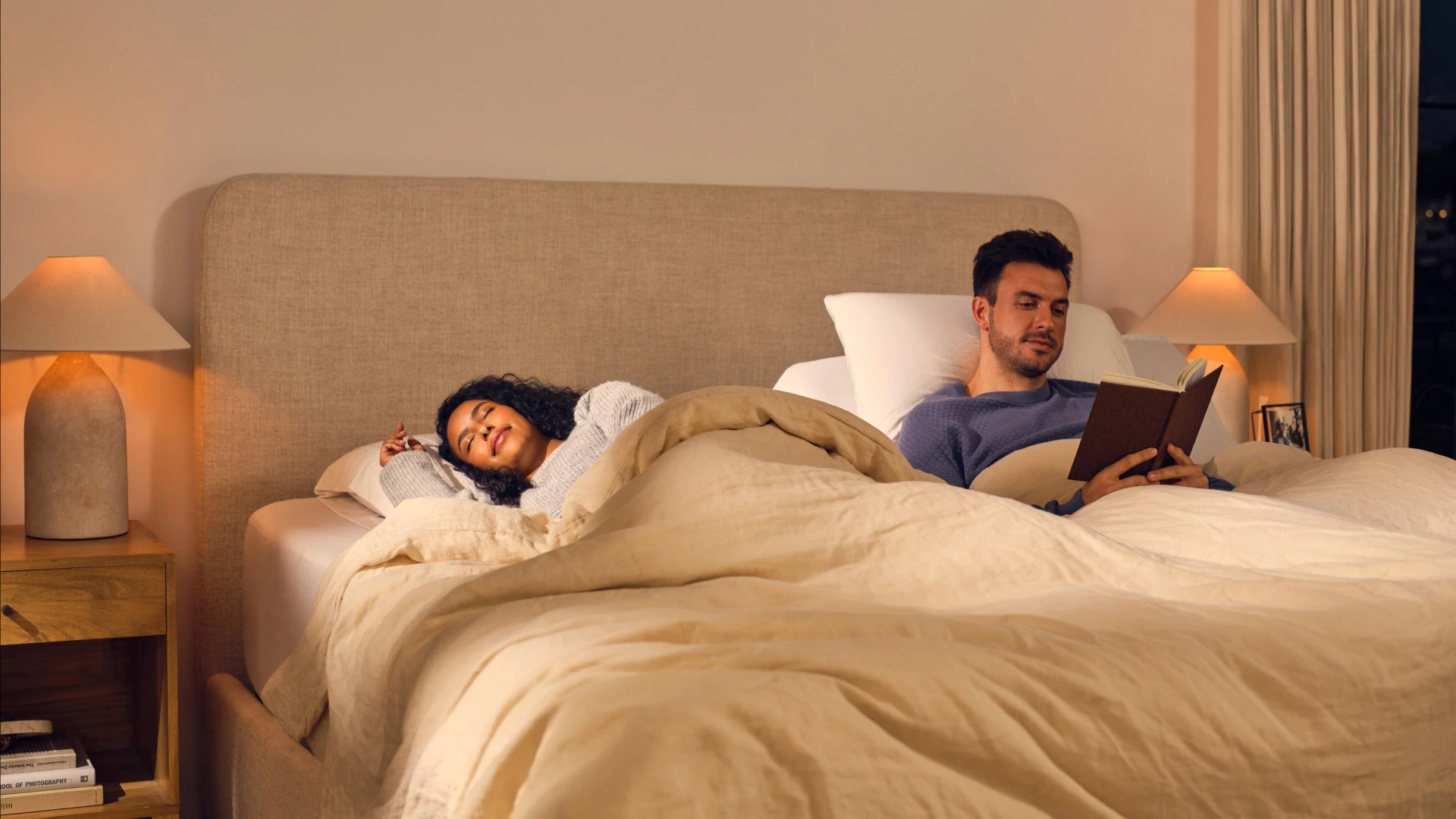 Couple on split king adjustable bed