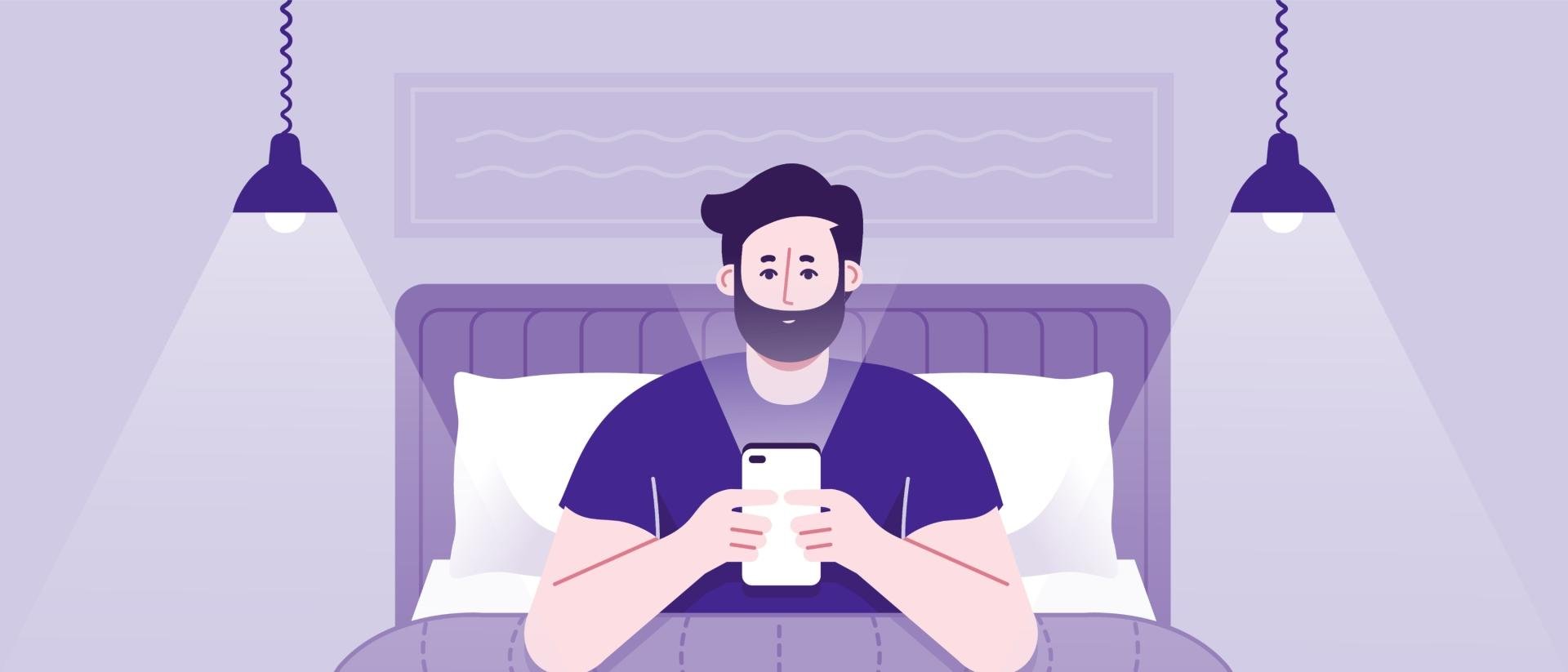 man sitting in bed with lights on