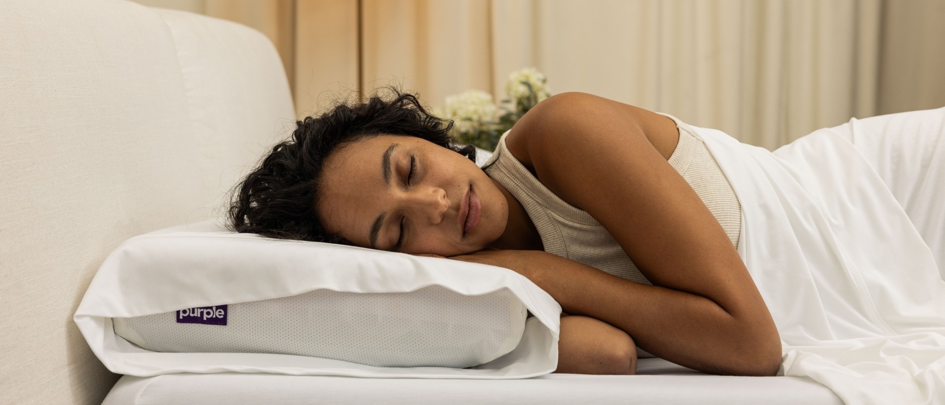 woman sleeping on purple pillow