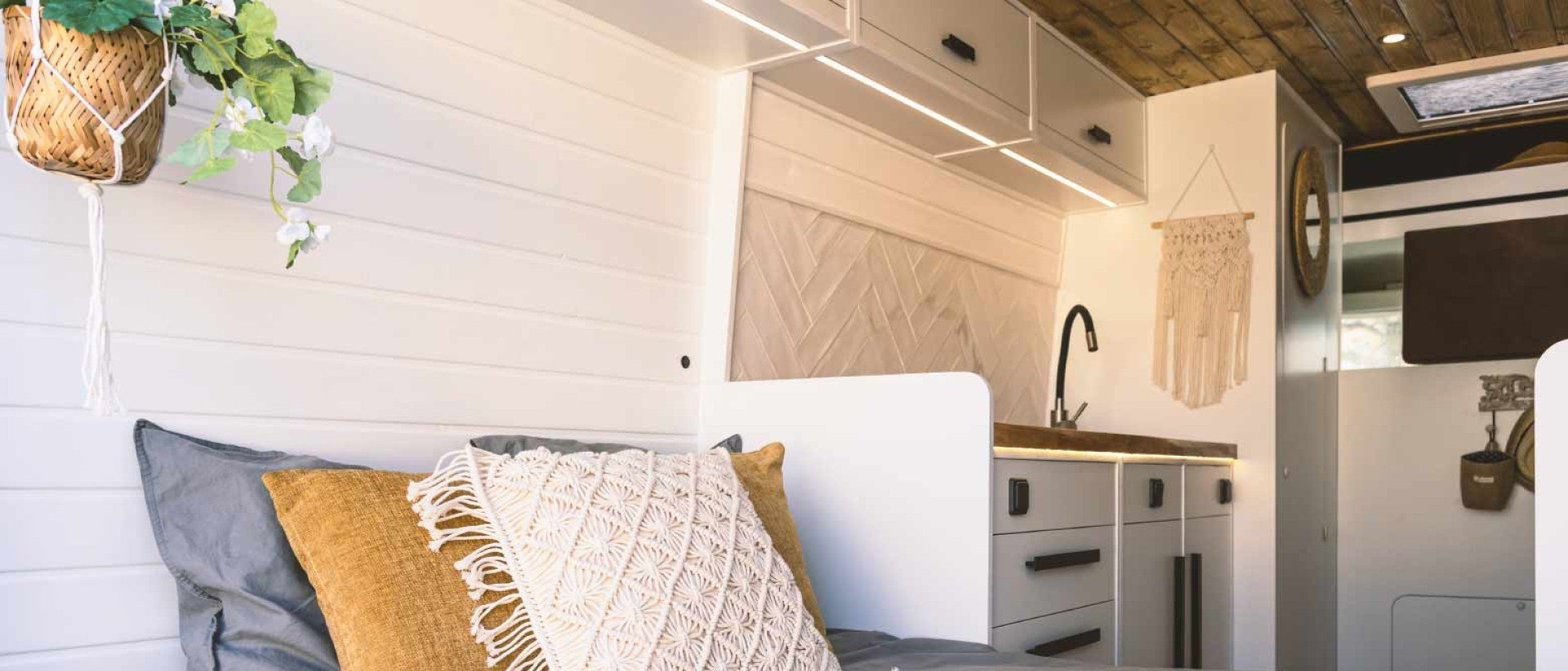 A short queen mattress in a cozy RV bedroom.