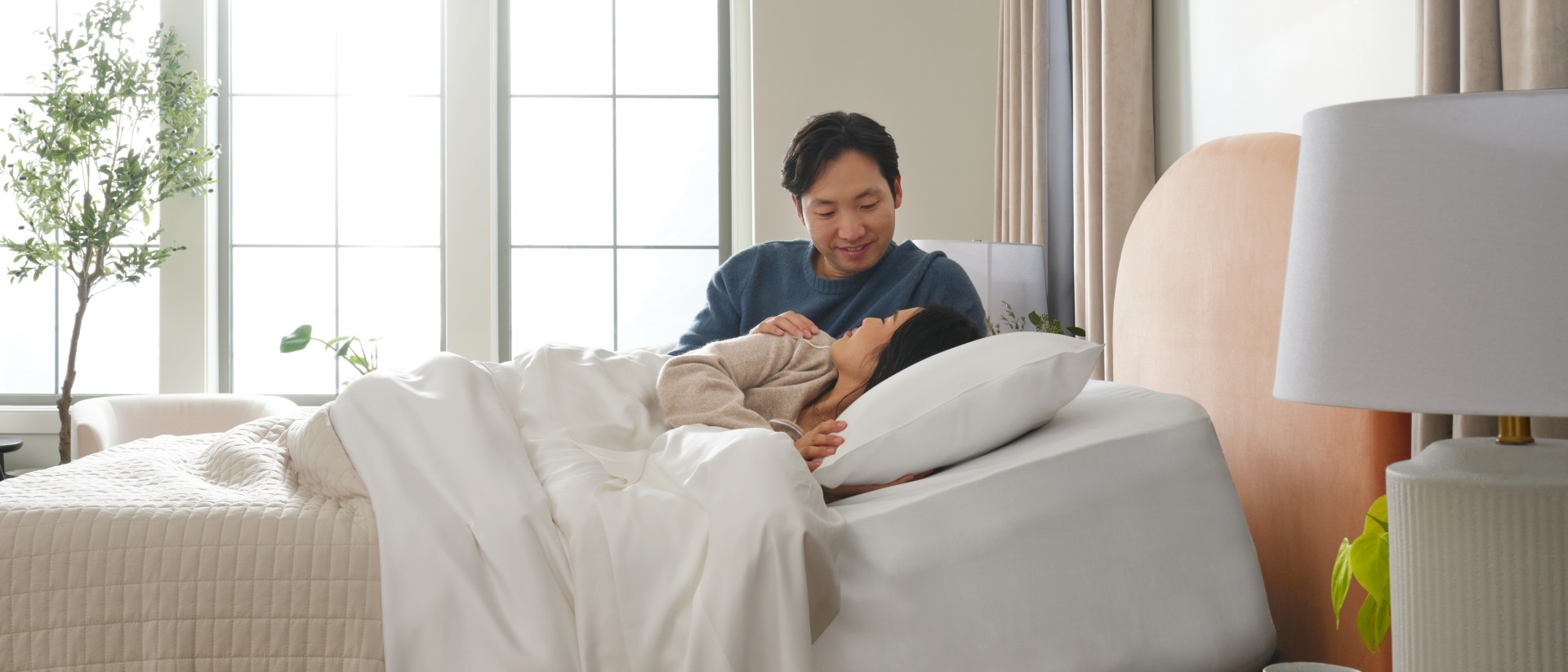 Happy couple laying in bed