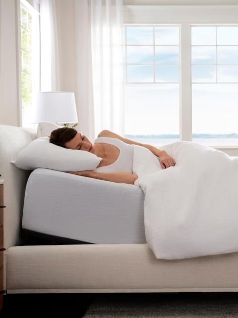 Woman sleeping in anti-snore mode on adjustable base