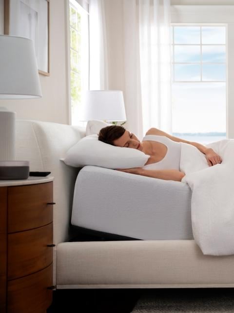 Woman sleeping in anti-snore mode on adjustable base