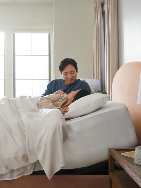 Happy couple laying in bed