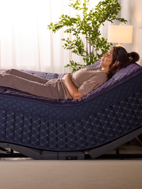 Talent laying on Rejuvenate Royale adjustable base