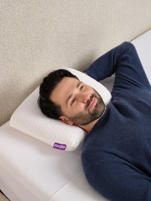 Man lying on Harmony Anywhere pillow
